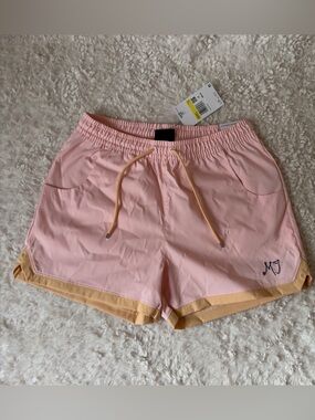 Air Jordan by Nike Pink Athletic Shorts with Orange Trim Women’s size small NWT